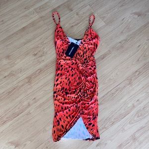 Bodycon dress with ruched bottom.